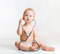 cute baby with stethoscope in hands