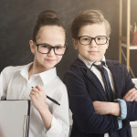 Cute boy and girl working together as team