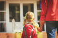 father and little daughter go to school or daycare