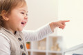 48141649 - happy smiling toddler girl excited to play the piano