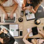 Group of women working together in coffee shop