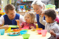 Couple and children playing with toys