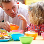 Man with children playing together