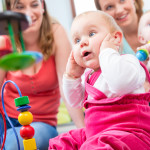 Cute baby girl showing progress and curiosity