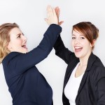 Two business women presenting teamwork