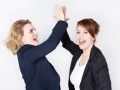 Two business women presenting teamwork